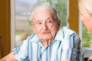 Senior Man Talking with Nurse